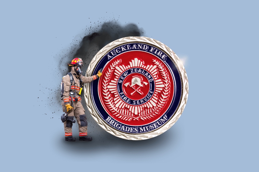 Picture of a firefighter standing next to a custom firefighter challenge coin.