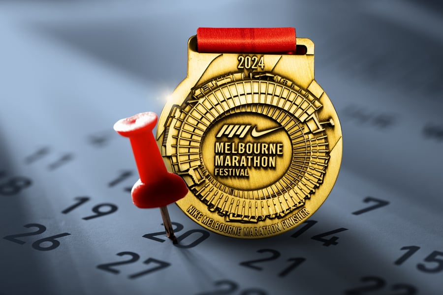 Melbourne Marathon custom medal on top of a calendar