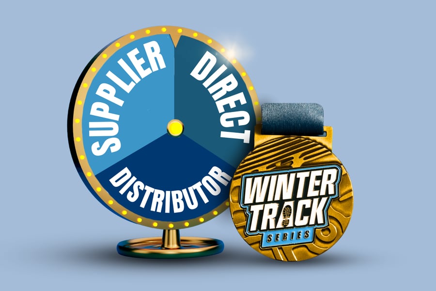 Custom Winter Track Series medal next to a game wheel.