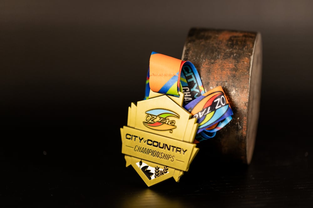 A custom 'City V Country Championships' medal made for OzTag Australia.