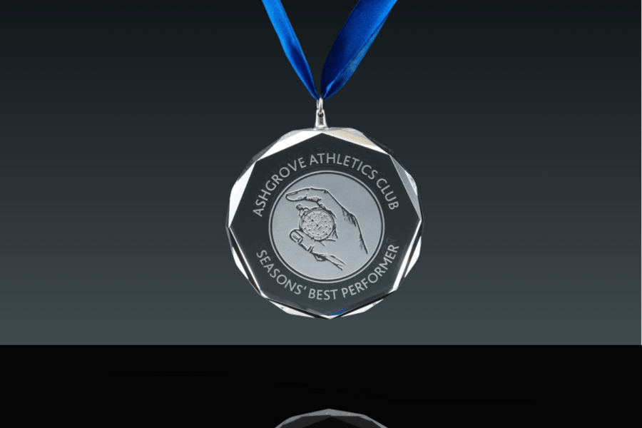 A custom crystal medal made for the Ashgrove Athletics Club.