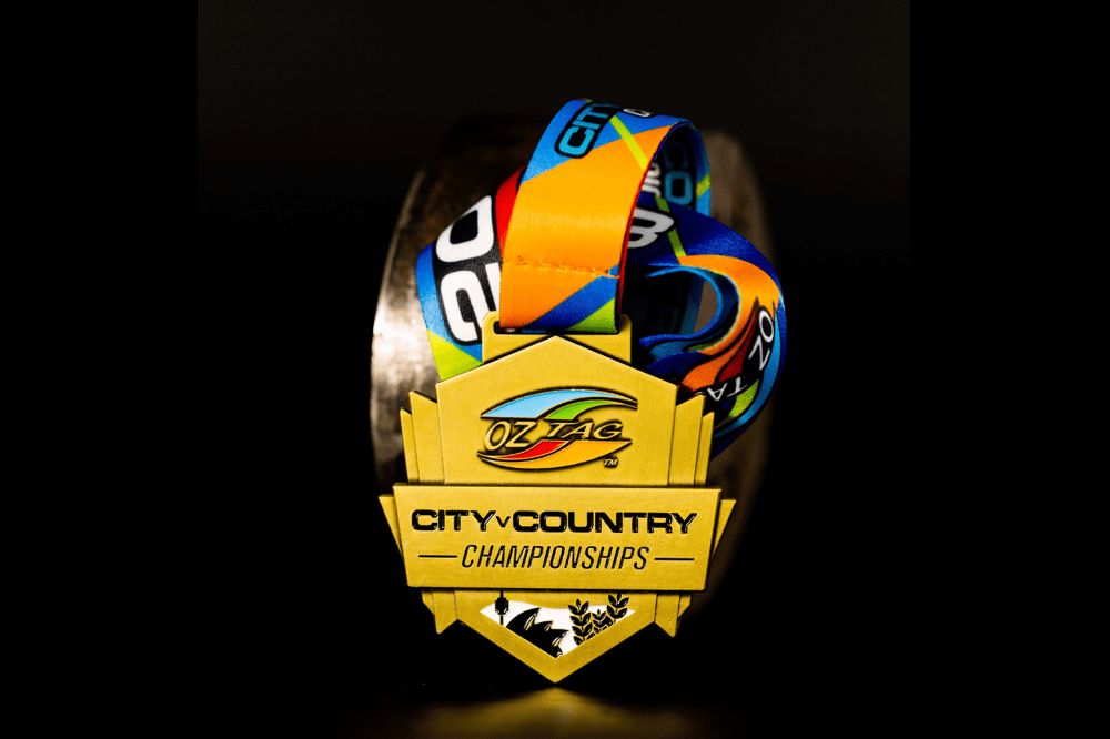 Professional photograph of Australian Oztag's custom 'City V Country Championships' medal.