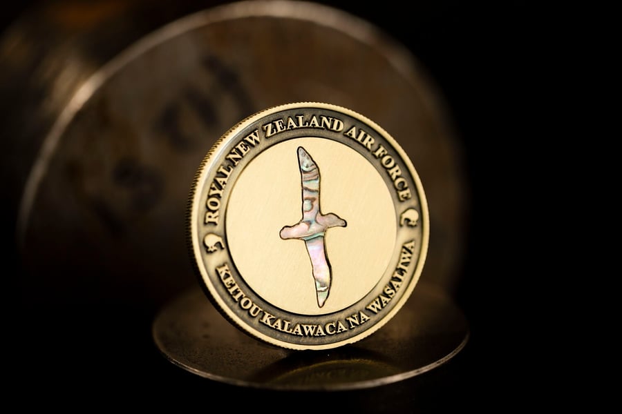 Custom Royal New Zealand Air Force challenge coin with seashell.